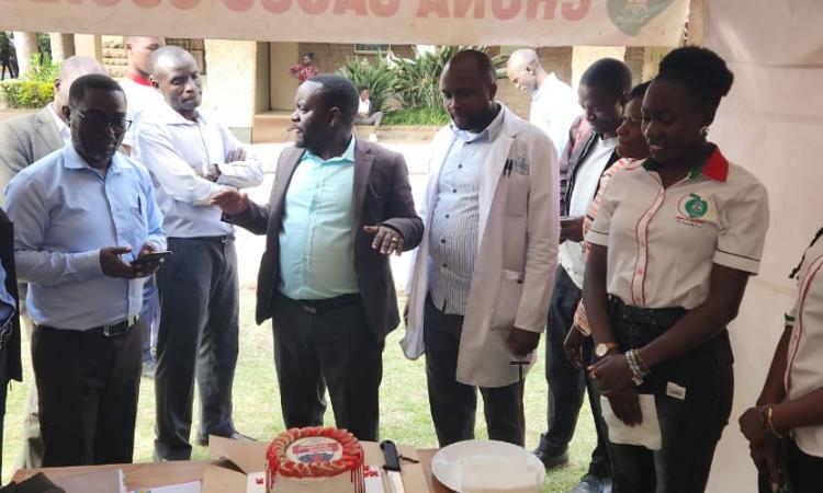 Mr. John Waweru briefs a section of members attending customer service week at UoN-Main Campus